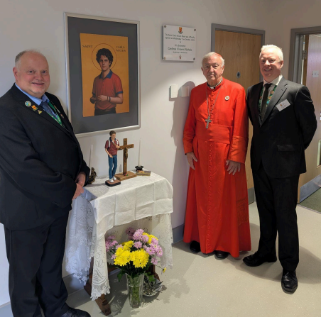 Cardinal Vincent Nichols, Mr Andrew Dunne and Mr John Roche celebrate the opening of the Saint Carlo Acutis Block.